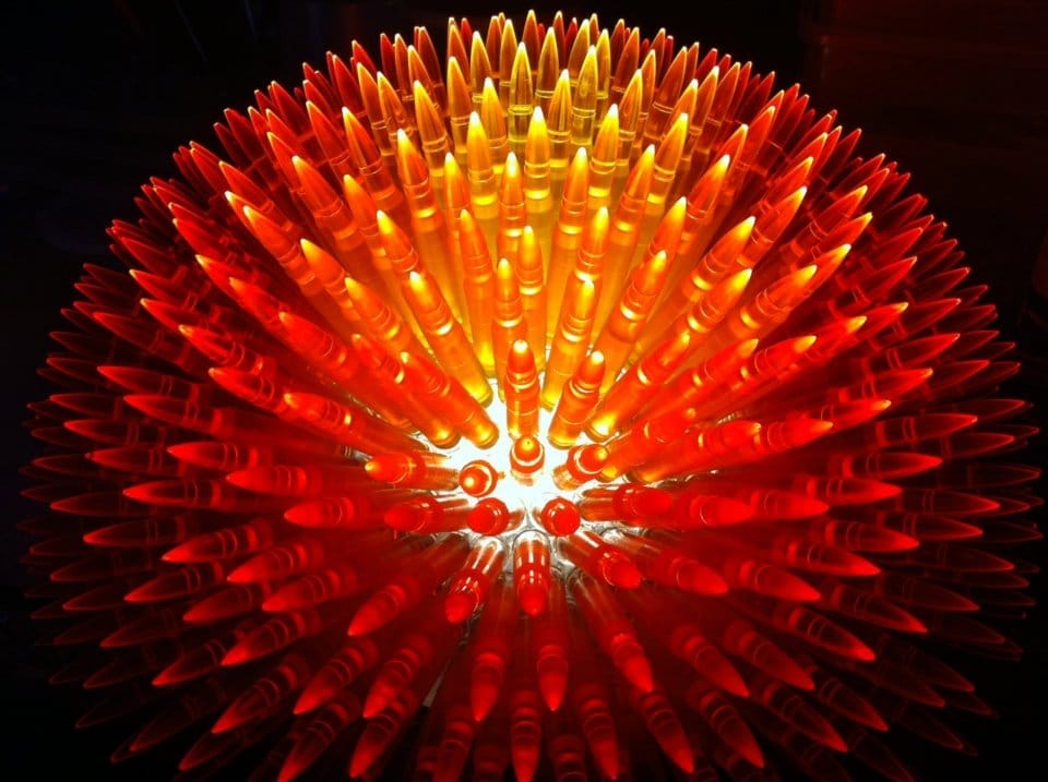 Update: A RED and orange light sculpture on a table catches attention in unusual news stories.