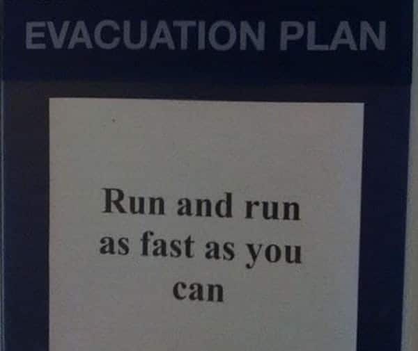 A sign that says evacuation plan run and run as fast as you can, promoting safety during potential massacres.