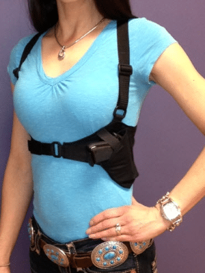 A woman wearing a holster posing for a picture in Indian Country.