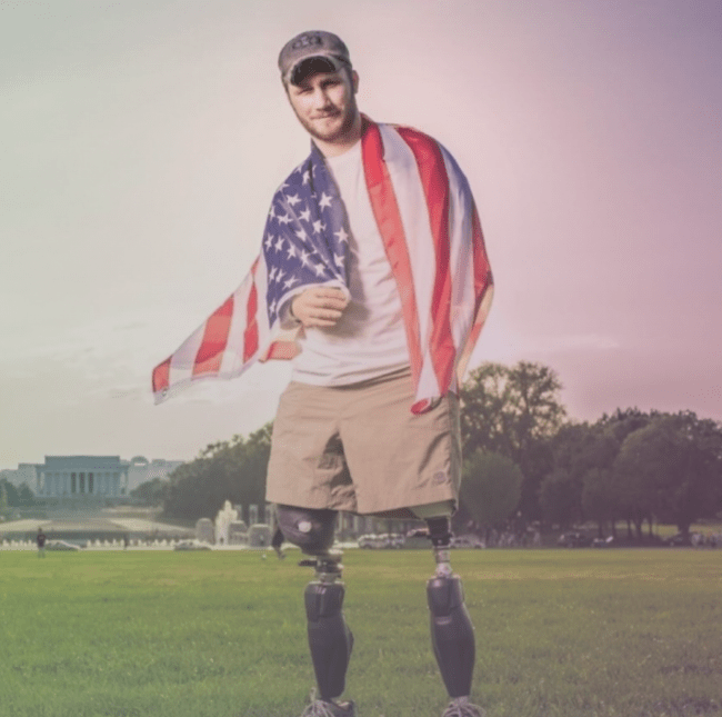 Man with no legs with American flag over his shoulders