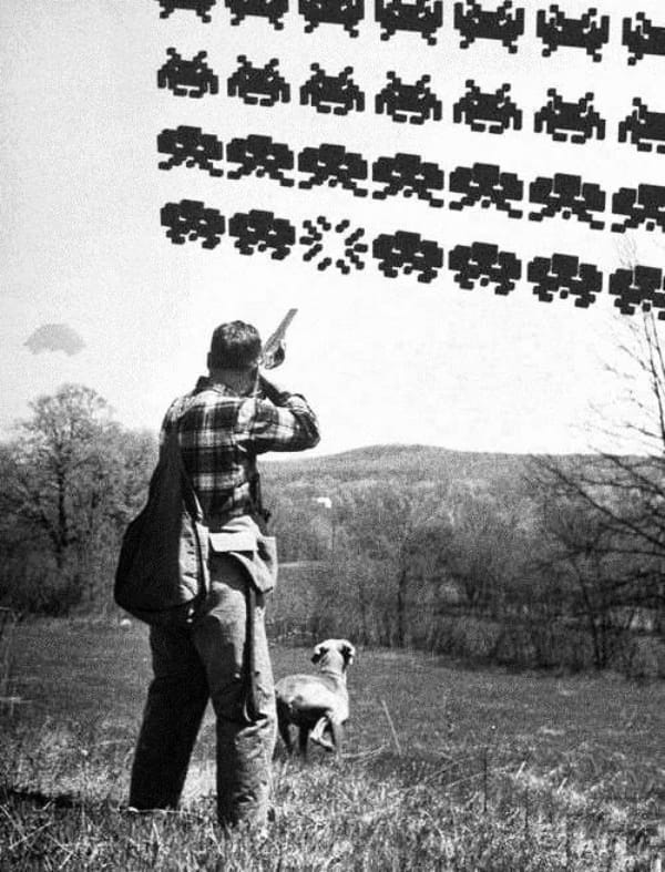 A person stands outdoors aiming a gun at pixelated alien invaders in the sky, with a dog nearby.